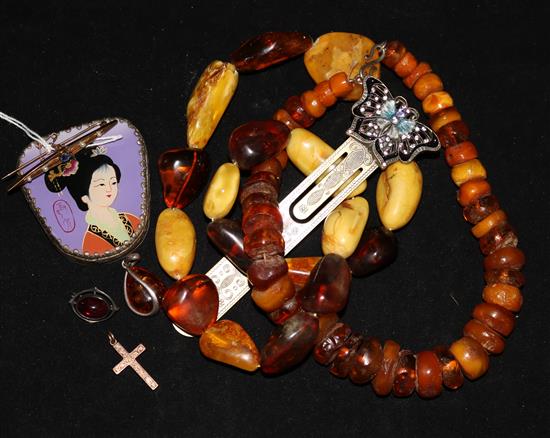 A 15ct gold and gem set bar brooch, a 9ct gold cross pendant, two amber necklaces and four other items including an Asprey box.